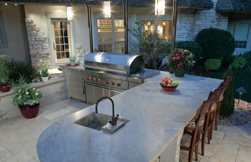 An outdoor kitchen is often planned next to or close to the kitchen of the house