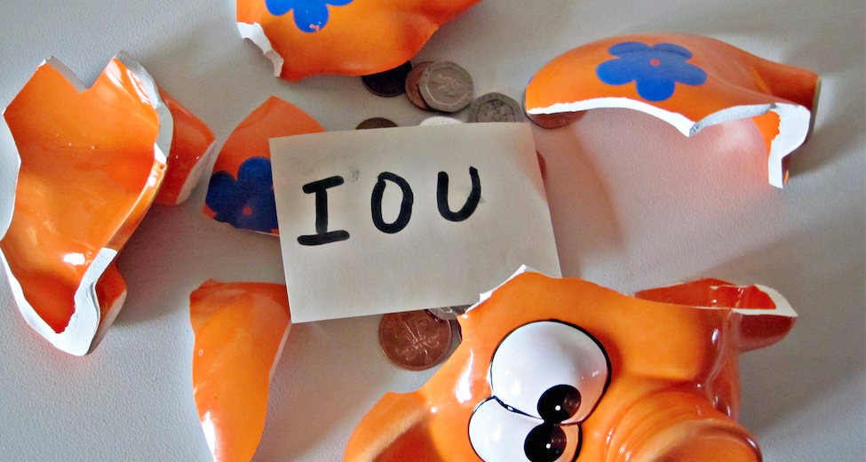 Unpaid invoices and IOU in piggy bank