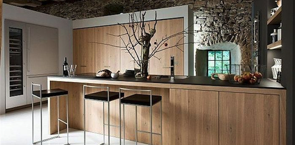 Modern rustic kitchen with stainless steel, wood, and stone.