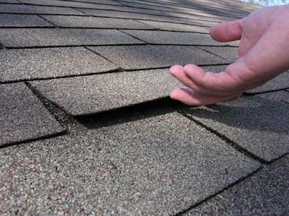 Loose shingles indicate use of short roofing nails, inspector says