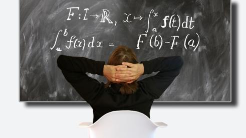 Lessons learned-man ponders equation on blackboard-Pixabay image