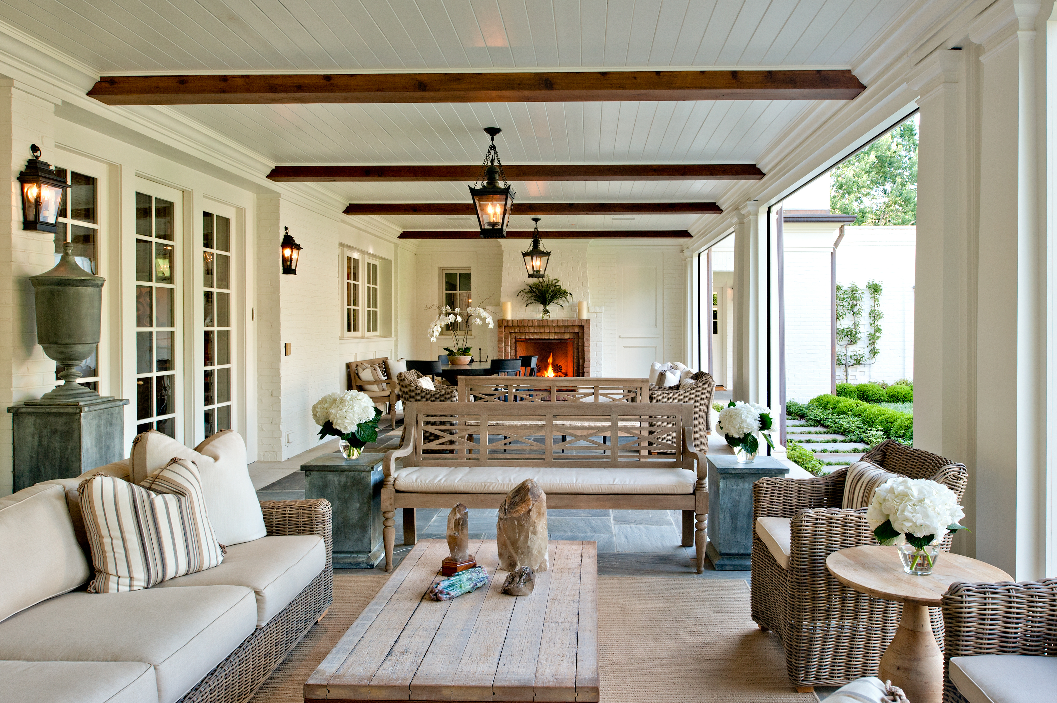 A new porch overlooking the grass courtyard serves as the homeowner’s primary en