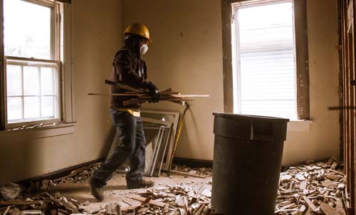 Plaster demolition worker