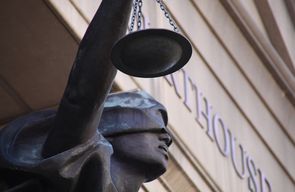scales of justice outside the courthouse
