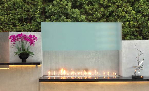 Fireplaces have long been a staple of outdoor room design, but more manufacturers are now making gas fireplaces for exterior use, dramatically altering the look of the space from rustic or transitional to a modern aesthetic. 