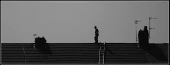 Man walking on roof