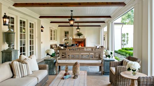 A new porch overlooking the grass courtyard serves as the homeowner’s primary en