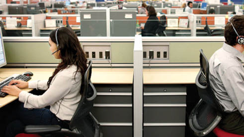 Call center workers at desks