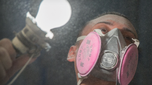 Worker with dust in the air on a jobsite. Photo: courtesy ITW