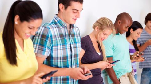 Group of youths communicating via text message