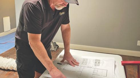 project construction manager reviewing plans