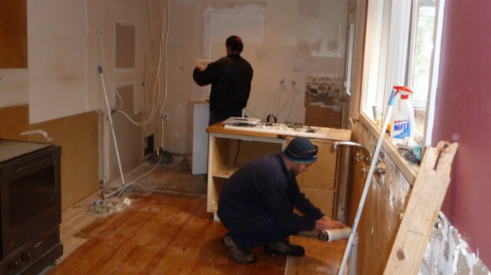 subcontractors—plumber and electrician—at work