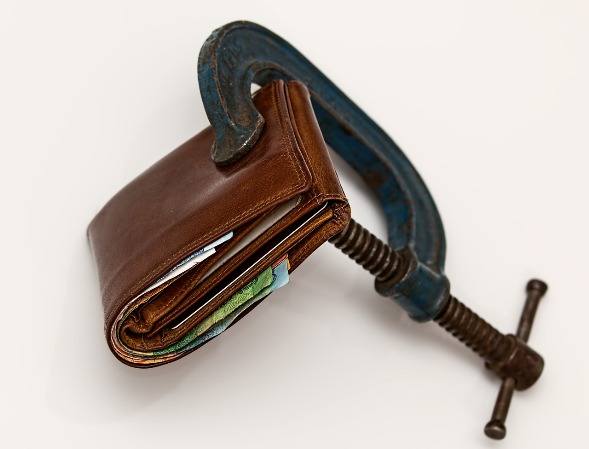 Wallet squeezed in a C-clamp