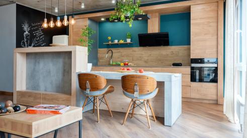 wood kitchen with blue accents 