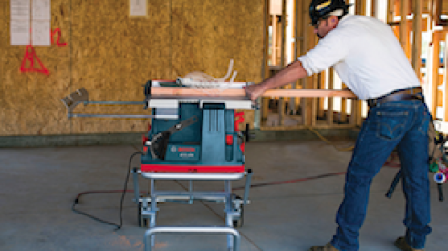 The Reaxx portable table saw in use.